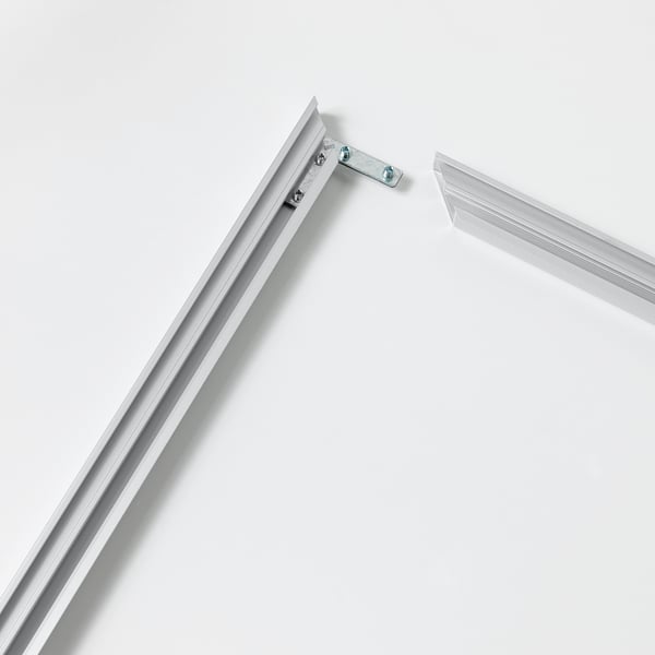 Close-up of metallic frame corner, clean, precise join, quality appearance.