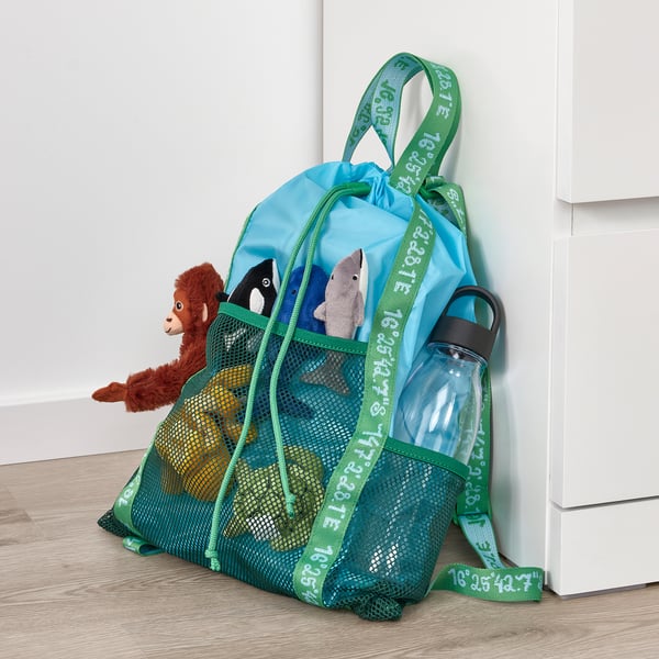Backpack with stuffed animals and water bottle. Mesh pockets for storage, ideal for beach or forest trips.