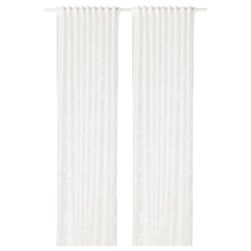 Two white sheer curtains with subtle patterns hung side by side.