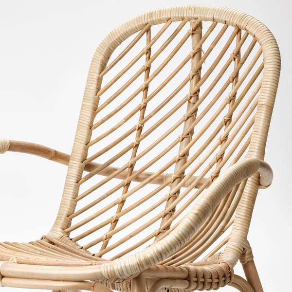 Woven rattan armchair, expertly crafted with sturdy, natural material. Intricate design quality & comfort.