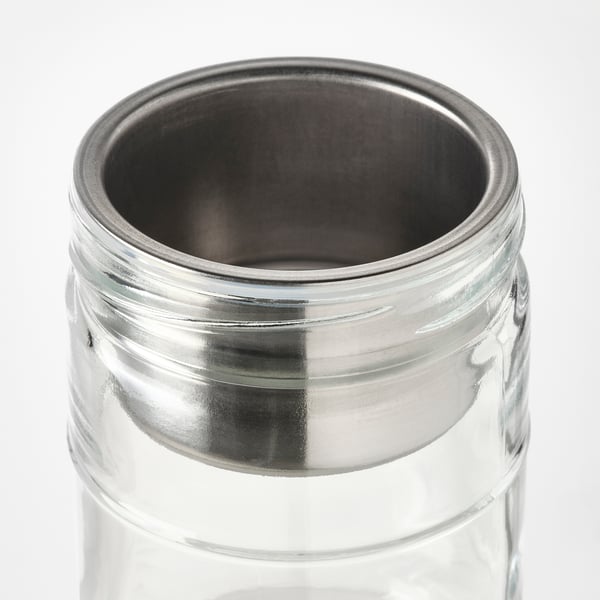 Clear glass jar with metal lid and insert, designed for storing dry and wet food separately.