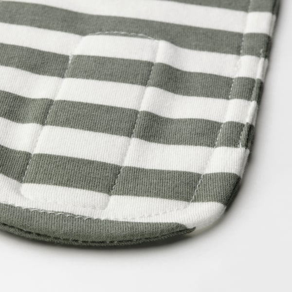 Close-up of soft, striped green and white cotton headband with adjustable fastener. Textured fabric, neat stitching.