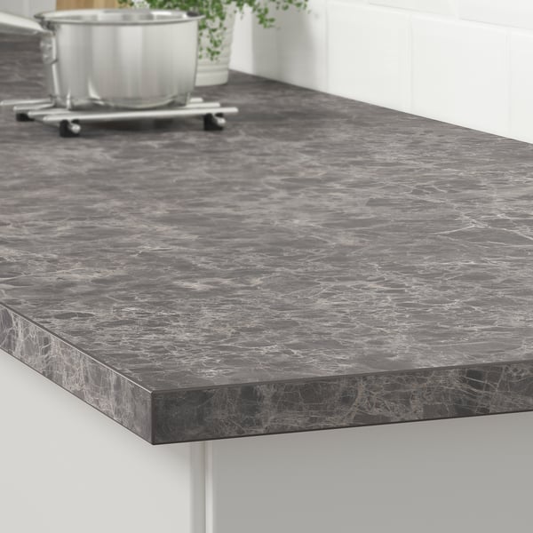Black marble-look kitchen countertop with white veins, polished finish.
