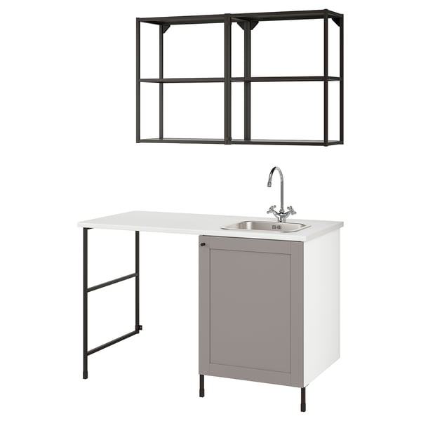 An IKEA ENHET white laundry unit with a grey cabinet, sink, and metal shelving unit.