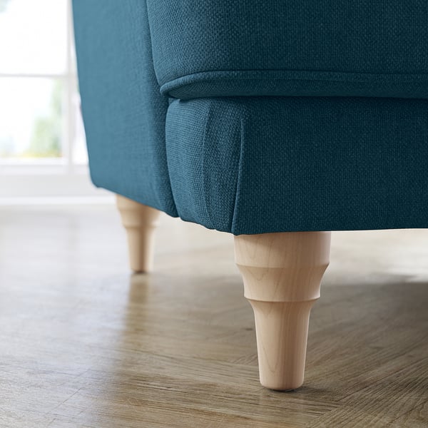 Blue fabric sofa with light wood legs, modern design.