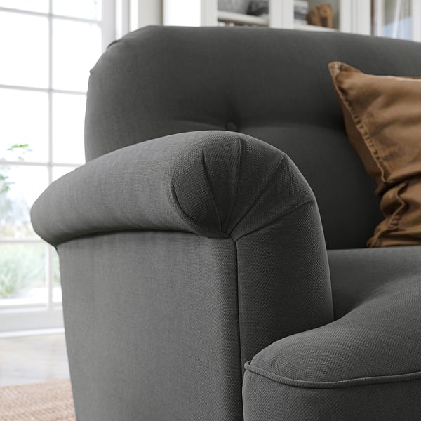 Modern grey curved sofa with dark brown cushion, soft chenille fabric, deep seats, high backrest, and elegant design.