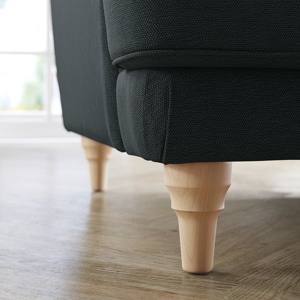 Close-up of dark grey ESSEBODA sofa legs, light wood, soft texture.