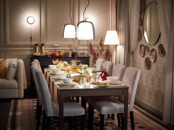 Elegant dining room with modern chandelier and sophisticated decor.