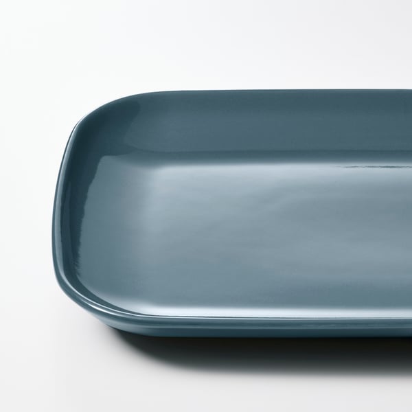 Smooth, rectangular stoneware plate in sleek blue, showcasing high-quality design and craftsmanship.