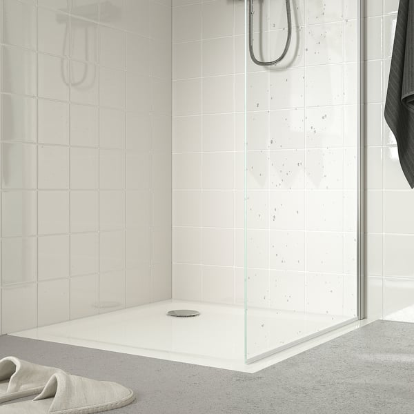Small, modern shower tray with anti-slip floor, designed for easy access and water efficiency.