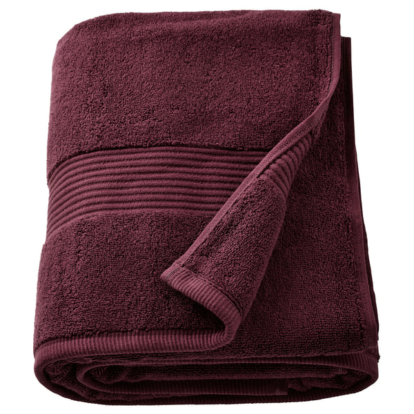 Red FREDRIKSJÖN bath towel folded, 100% cotton, thick, textured border.