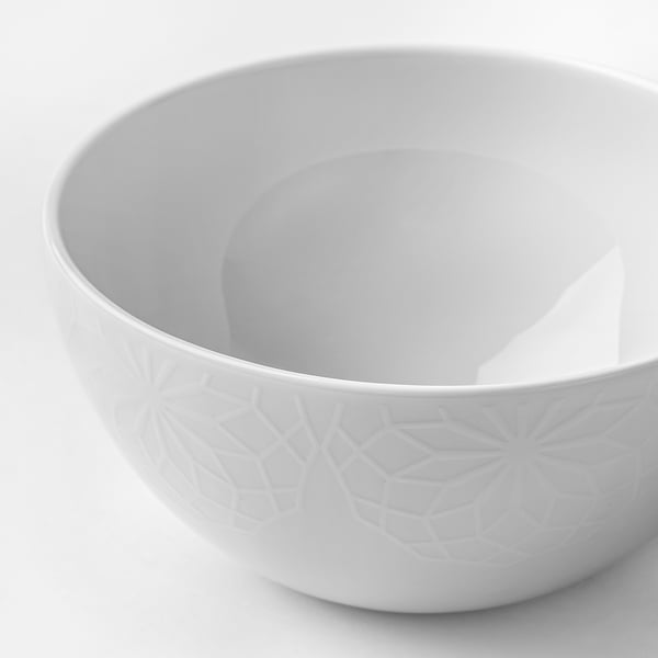 Elegant white porcelain bowl with embossed geometric pattern, dishes cleanly.