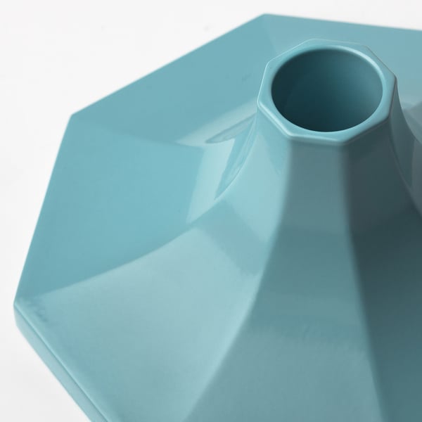 Blue geometric candlestick with smooth, matte finish and octagonal shape. Elegant and modern design.