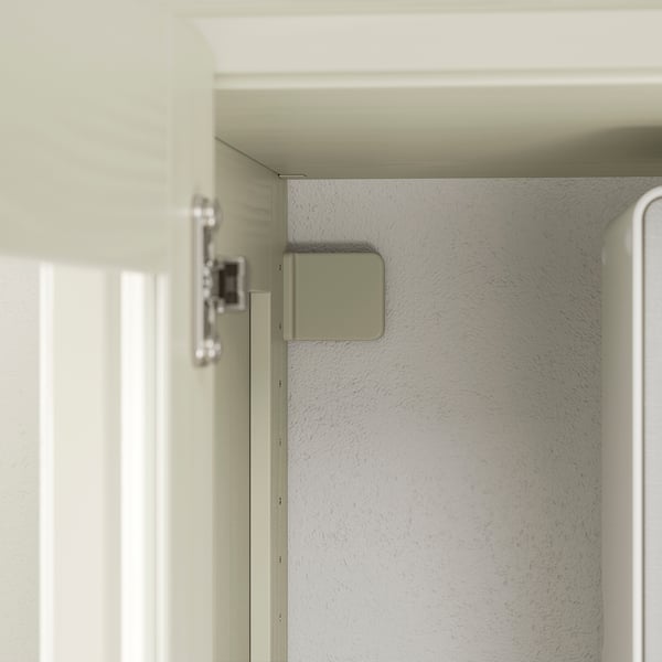 Close-up of cabinet hinge, showing quality construction with metal hinge and smooth, painted surfaces.