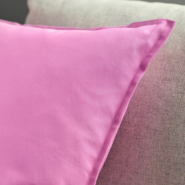 Bright pink throw pillow with crisp, clean seams, slightly puffed to show soft filling.