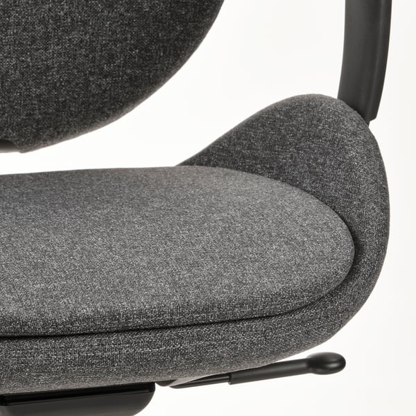 Close-up of modern office chair, showcasing ergonomic design, quality fabric, and sturdy armrest.