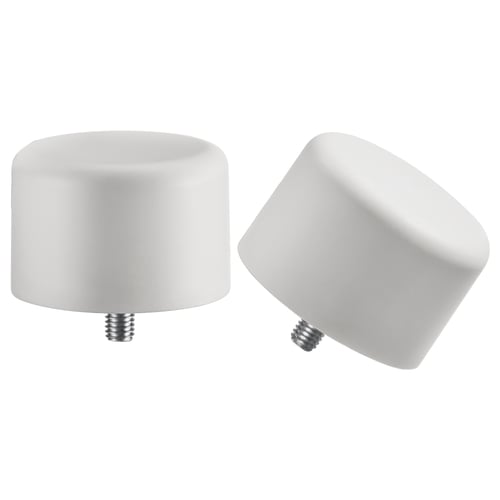 Two white circular finials, one upright, one tilted, with screws at the bottom. Minimalist design in recycled plastic.