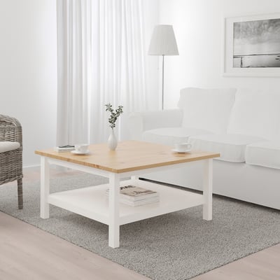 HEMNES natural pine & white coffee table with storage shelf in living room.