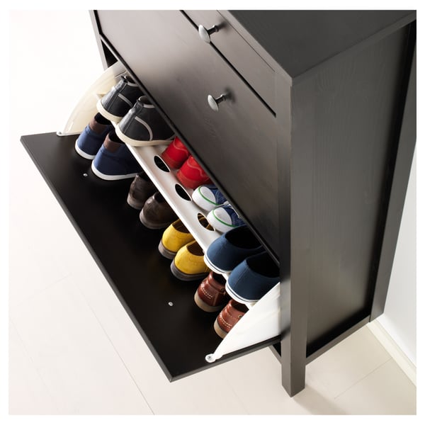 Black HEMNES shoe cabinet stores 14 pairs, keeping them ventilated and organised.