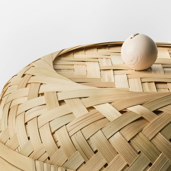 Elegant woven bamboo basket with herringbone pattern and lid, showcasing intricate craftsmanship.