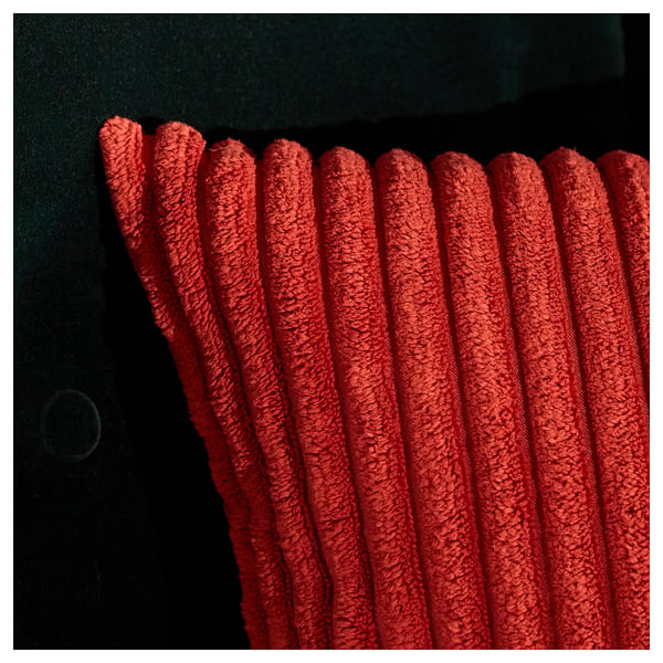 Close-up of rich, textured red corduroy fabric, showcasing its soft, ribbed texture and deep, inviting colour.
