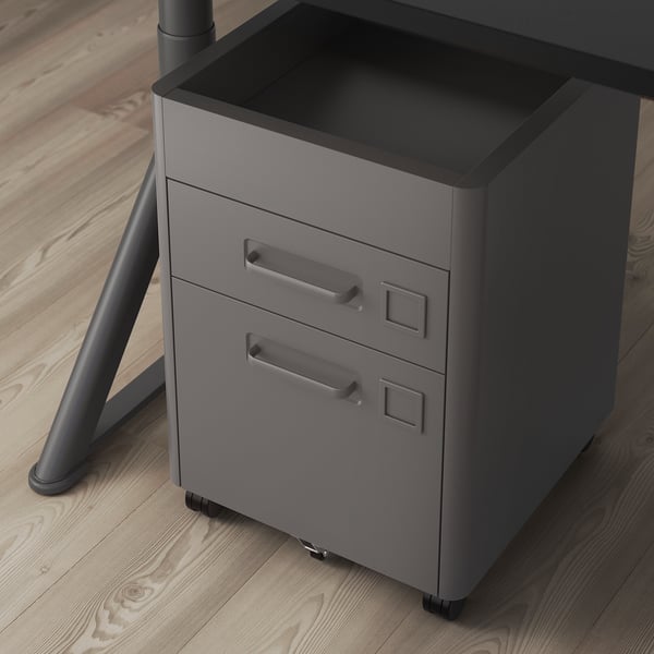 A grey metal filing cabinet with two drawers and a handle on each. The unit has built-in locks and casters for mobility.