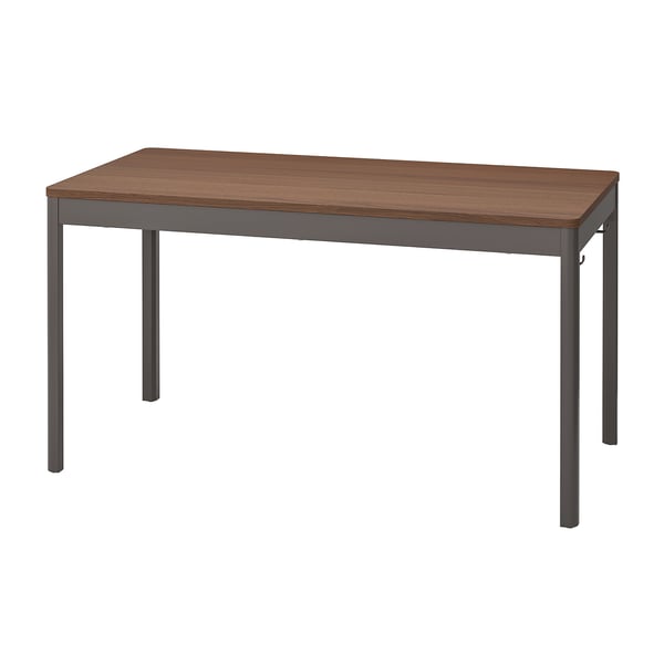 An IDÅSEN desk with a brown top and dark grey metal legs. Its rectangular, simple, and suitable for home or office use.