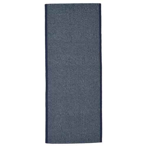 Dark blue rectangle cotton rug with white fibres; simple, flat surface.