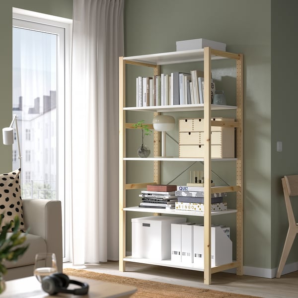 Light IVAR shelving holds books, boxes, near ceiling.