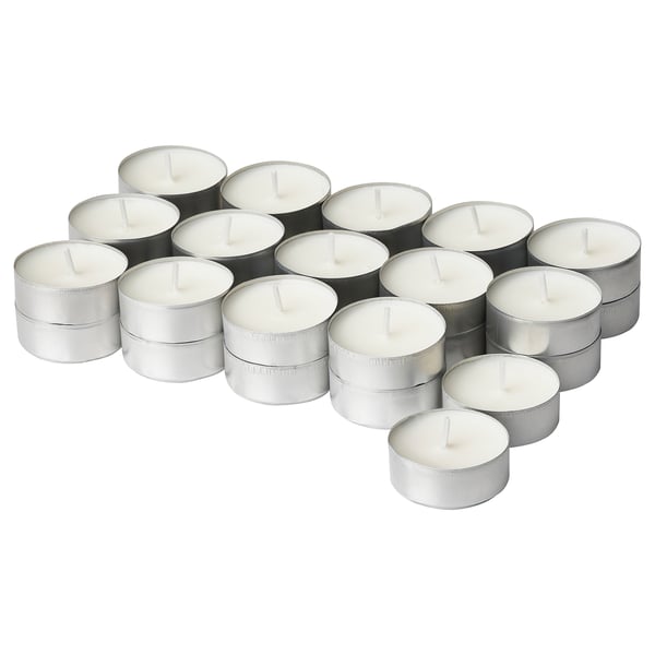Group of white tea light candles, cylindrical shape, silver aluminium holders.