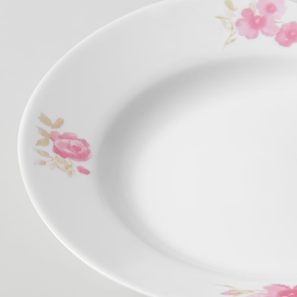 Elegant dish with delicate pink rose decals, smooth finish. Bowl-shaped, pristine white.