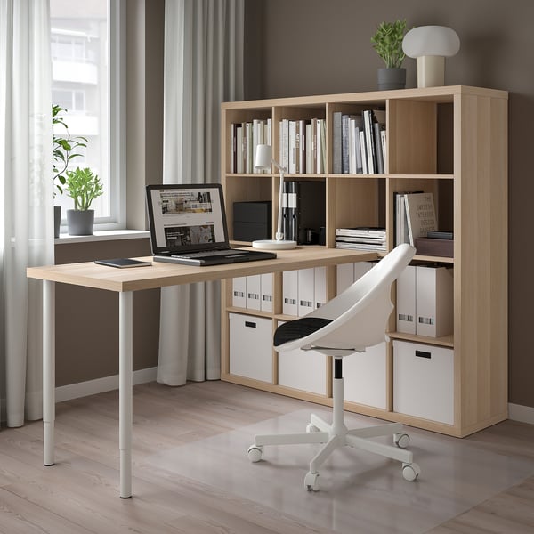 KALLAX desk with laptop, chair, and window.
