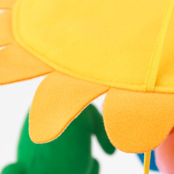 Bright yellow and orange sunflower cuddly toy with green stem; detail shot focusing on stitching quality.
