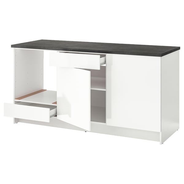 KNOXHULT white modular kitchen unit. Drawers and open shelf. Sleek, modern design with black countertop.