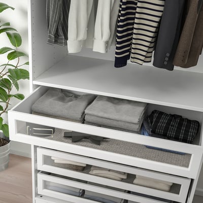 White wardrobe drawer with glass front, organising folded clothes and ties. It closes softly and fits pax frames.