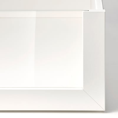 Close-up of white cabinets edge, smooth finish, seamless joints, and modern design.