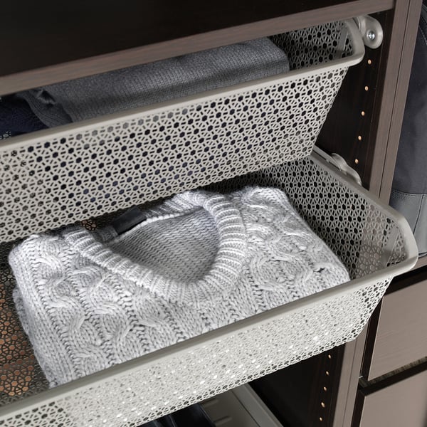 Metal mesh basket in wardrobe for air circulation, folds clothes, socks, or accessories neatly.