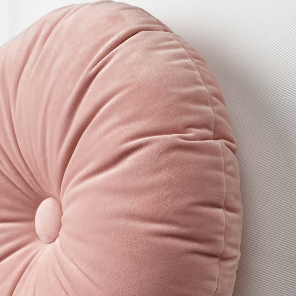 Contribue to a soft, round cushion with a central button, showcasing quality texture and design.