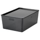 A KUGGIS storage box in grey. Made of recycled pet plastic, it two handles and a sleek rectangular design.