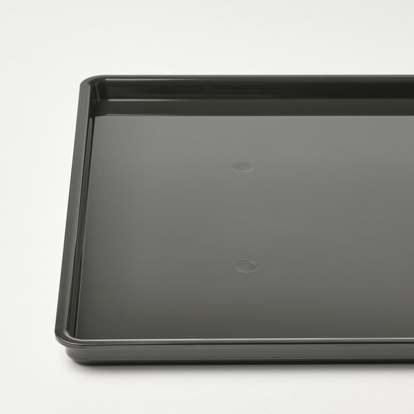 Black rectangular plastic lid with two small drainage holes, part of KUGGIS series.