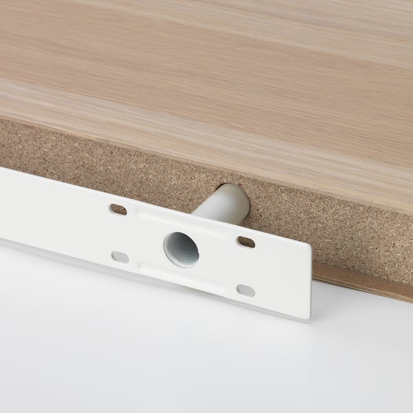 Close-up of a modern wall shelfs underside, showcasing durable materials and hidden mounting brackets.