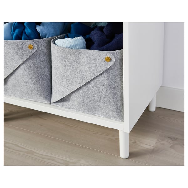 White platsa storage with grey LÄTTHET bins holding folded blue clothes.
