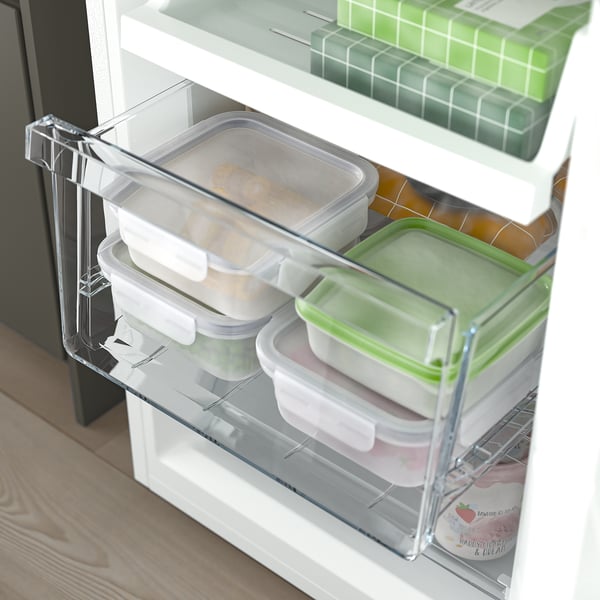 Open fridge with adjustable shelves and clear drawers showing stored food.