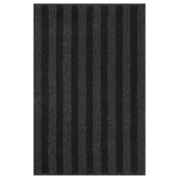 A dark grey LANDSVÄG rug with vertical stripes, featuring a soft, low pile texture.