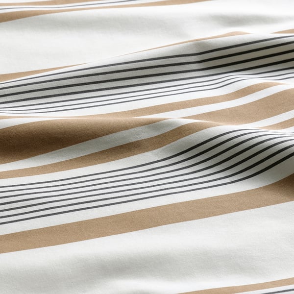 Striped pillowcase in beige tones; one side thin stripes, the other wide ones. Soft fabric, quality cotton-viscose blend.