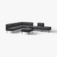 Modern dark grey modular sofa set with sleek legs, including a corner piece, two ottomans, and an armless chair.