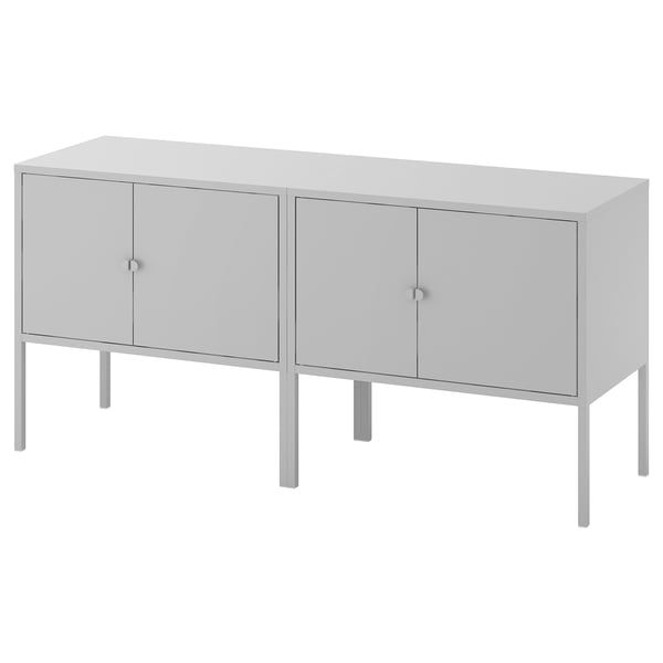 A LIXHULT grey sideboard with four doors and metal legs. Its a modern, rectangular design for storage.