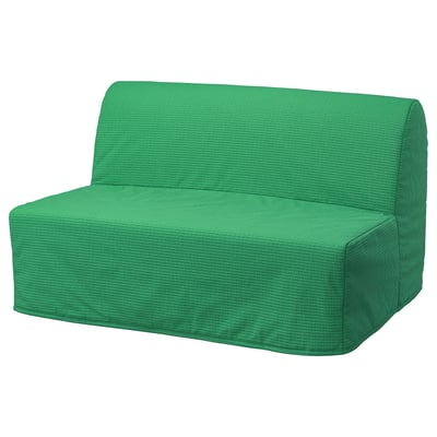 Bright green convertible sofa. Modern design, simple shapes, comfortable cushions.
