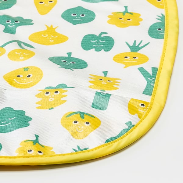 White bib with yellow and green playful veggie prints, yellow trim, quality fabric.