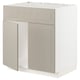 Beige METOD kitchen cabinet, rectangular with two doors, made from particleboard and fiberboard.
